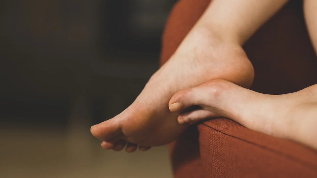 close-up of a hand performing a gentle massage on a foot, focus on relaxed energy, warm lighting, holistic healing environment, photo style